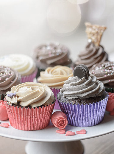 Sweet cupcakes with little heart candies